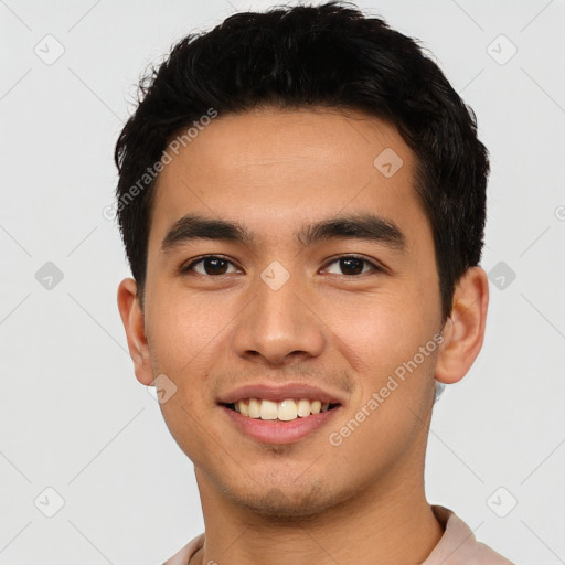 Joyful asian young-adult male with short  black hair and brown eyes