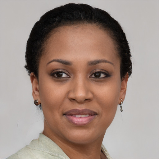 Joyful black young-adult female with short  brown hair and brown eyes