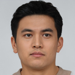 Neutral asian young-adult male with short  brown hair and brown eyes