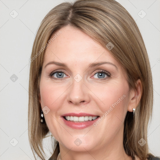 Joyful white adult female with medium  brown hair and grey eyes