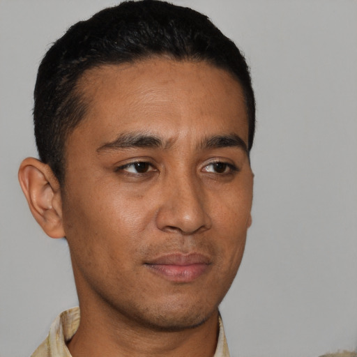 Neutral latino young-adult male with short  black hair and brown eyes