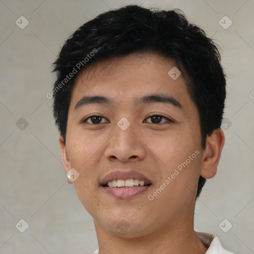 Joyful asian young-adult male with short  black hair and brown eyes