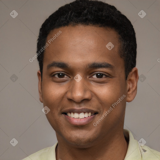 Joyful black young-adult male with short  black hair and brown eyes