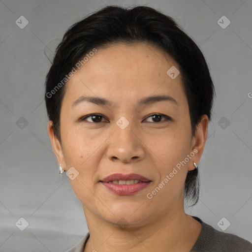 Joyful asian adult female with short  brown hair and brown eyes