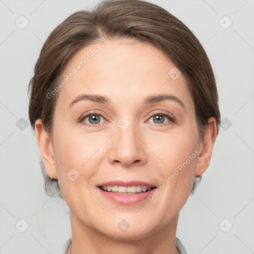 Joyful white adult female with short  brown hair and grey eyes