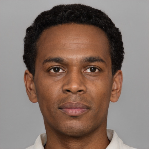 Neutral black young-adult male with short  brown hair and brown eyes