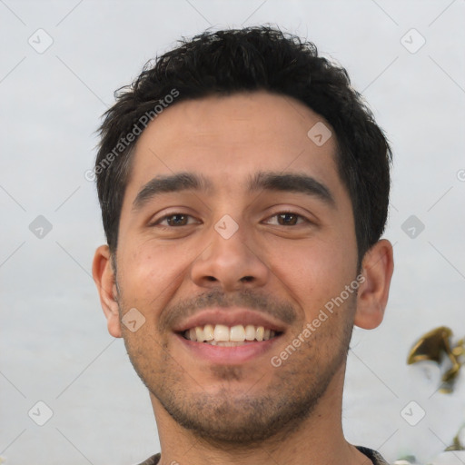 Joyful white young-adult male with short  black hair and brown eyes