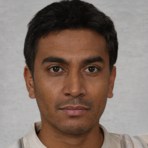 Neutral latino young-adult male with short  brown hair and brown eyes