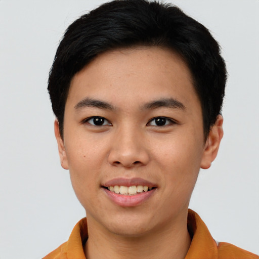 Joyful asian young-adult female with short  black hair and brown eyes