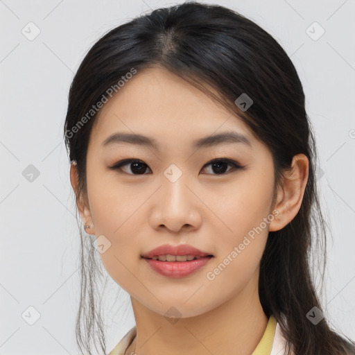 Joyful asian young-adult female with long  brown hair and brown eyes