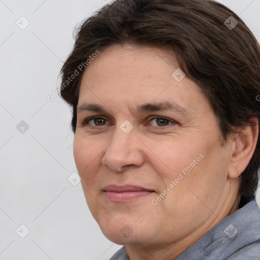 Joyful white adult female with medium  brown hair and brown eyes