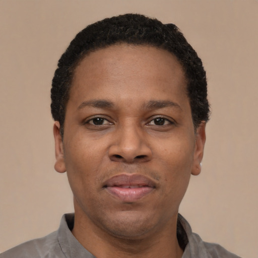 Neutral latino adult male with short  black hair and brown eyes