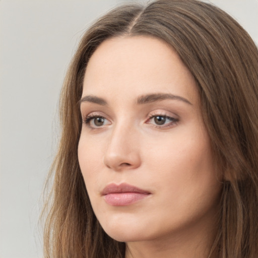 Neutral white young-adult female with long  brown hair and brown eyes