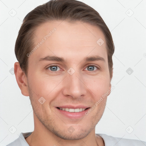 Joyful white young-adult male with short  brown hair and grey eyes