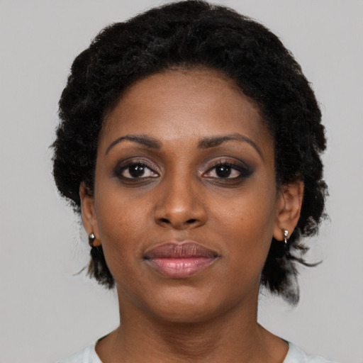 Neutral black young-adult female with short  black hair and brown eyes