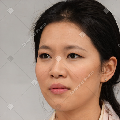 Joyful asian young-adult female with medium  black hair and brown eyes