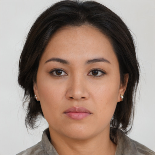 Neutral asian young-adult female with medium  brown hair and brown eyes
