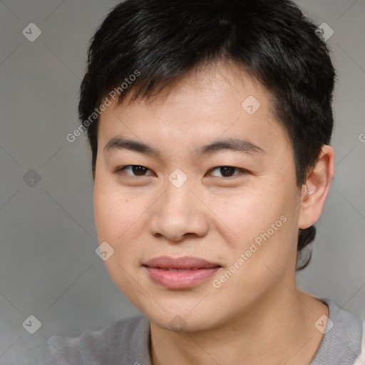 Joyful asian young-adult male with short  brown hair and brown eyes