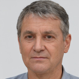 Joyful white middle-aged male with short  brown hair and brown eyes