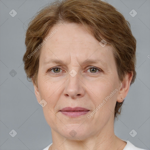 Joyful white adult female with short  brown hair and grey eyes