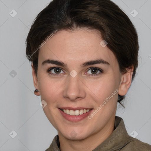 Joyful white young-adult female with medium  brown hair and grey eyes