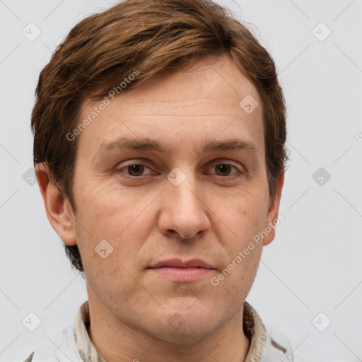 Joyful white adult male with short  brown hair and grey eyes