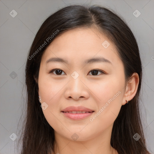 Joyful asian young-adult female with long  brown hair and brown eyes