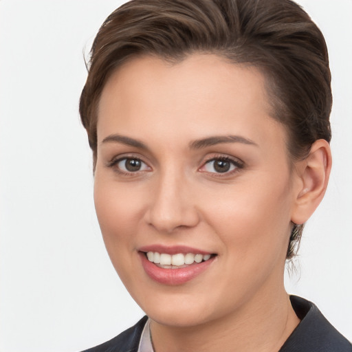 Joyful white young-adult female with short  brown hair and brown eyes