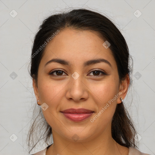 Joyful latino young-adult female with medium  brown hair and brown eyes