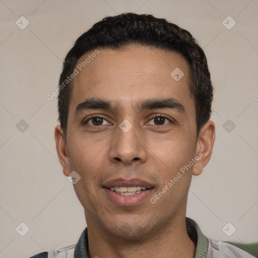 Joyful white young-adult male with short  black hair and brown eyes