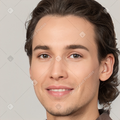 Joyful white young-adult male with medium  brown hair and brown eyes