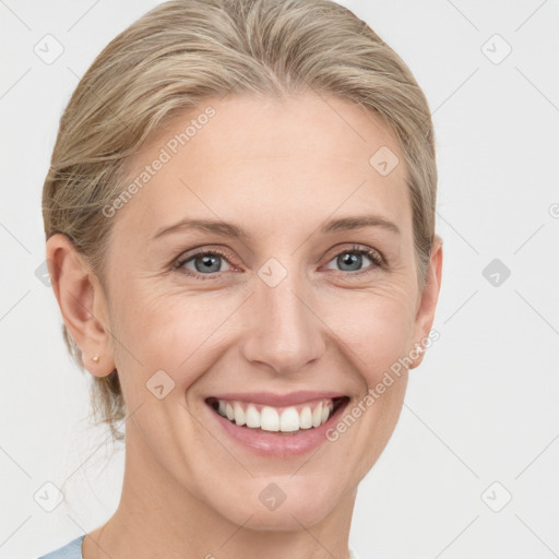 Joyful white young-adult female with medium  brown hair and blue eyes