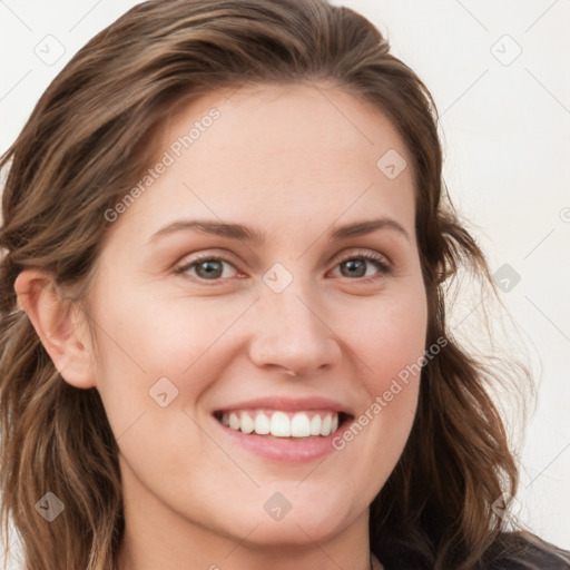 Joyful white young-adult female with long  brown hair and blue eyes