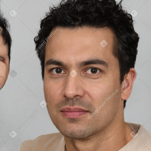 Joyful white young-adult male with short  black hair and brown eyes