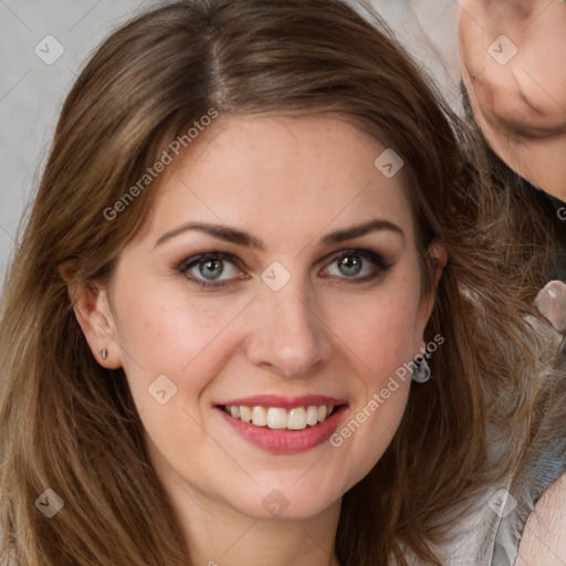 Joyful white adult female with long  brown hair and grey eyes