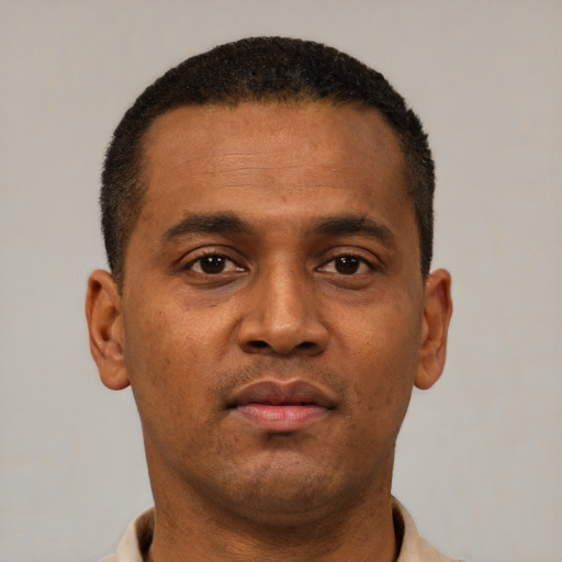 Neutral latino young-adult male with short  brown hair and brown eyes