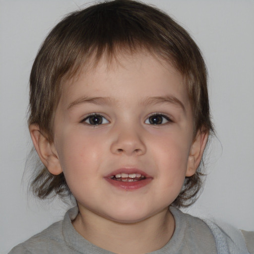 Joyful white child male with medium  brown hair and brown eyes