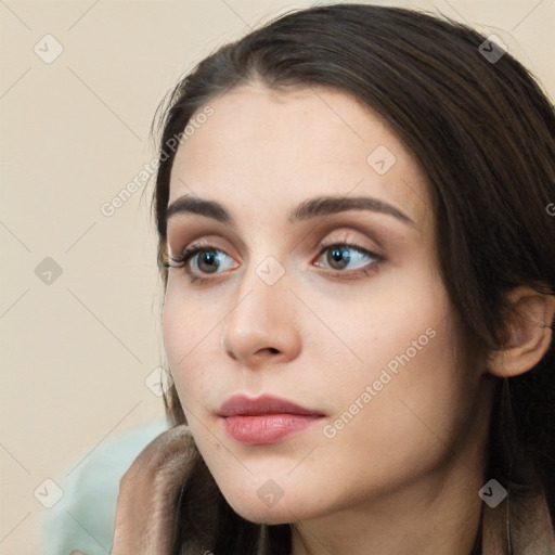 Neutral white young-adult female with long  brown hair and brown eyes