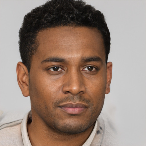 Neutral black young-adult male with short  brown hair and brown eyes
