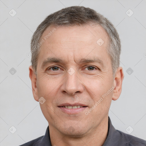 Joyful white adult male with short  brown hair and brown eyes