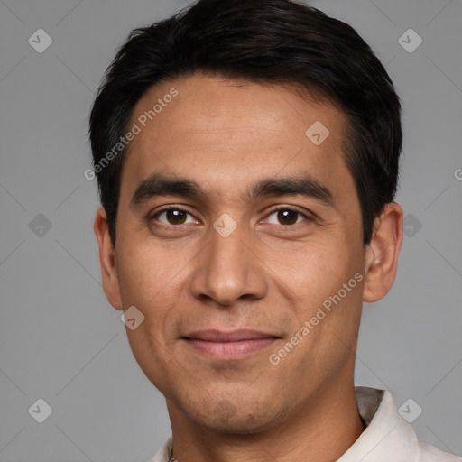 Joyful white young-adult male with short  black hair and brown eyes