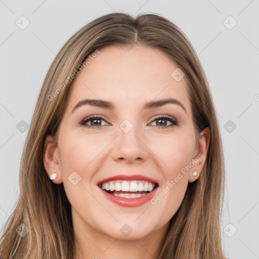 Joyful white young-adult female with long  brown hair and grey eyes