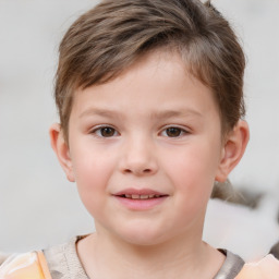 Joyful white child male with short  brown hair and brown eyes