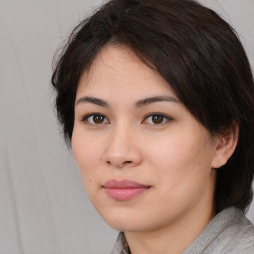 Neutral white young-adult female with medium  black hair and brown eyes