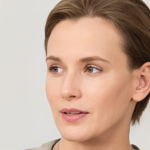 Neutral white young-adult female with medium  brown hair and brown eyes