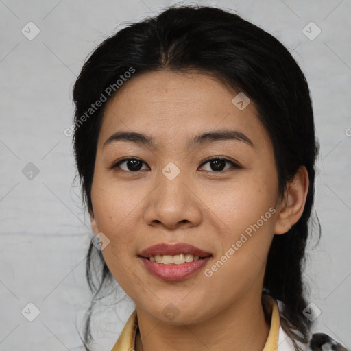 Joyful asian young-adult female with medium  black hair and brown eyes