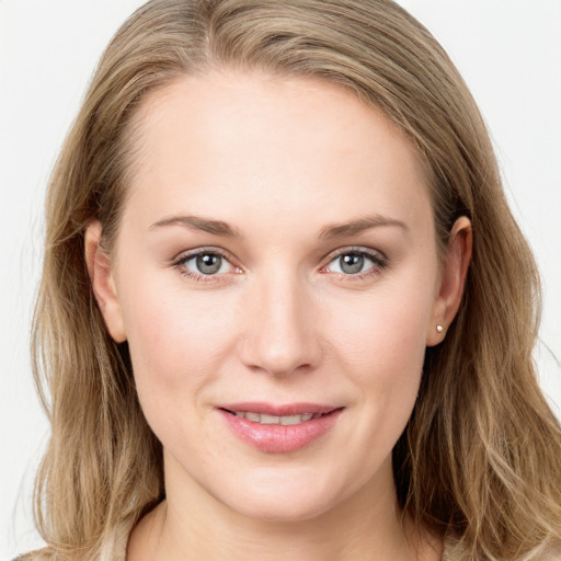 Joyful white young-adult female with long  brown hair and blue eyes