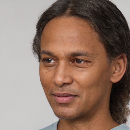 Joyful white adult male with medium  brown hair and brown eyes