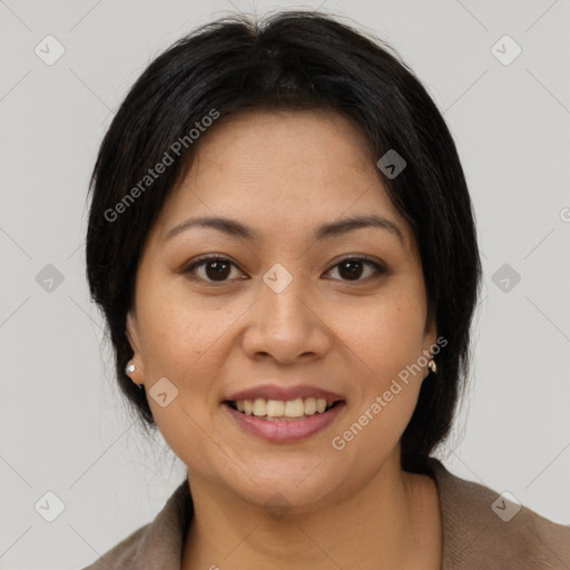 Joyful latino young-adult female with medium  brown hair and brown eyes