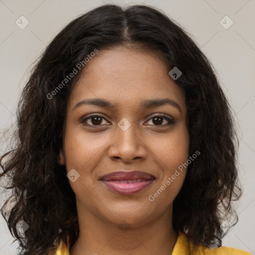 Joyful black young-adult female with long  brown hair and brown eyes